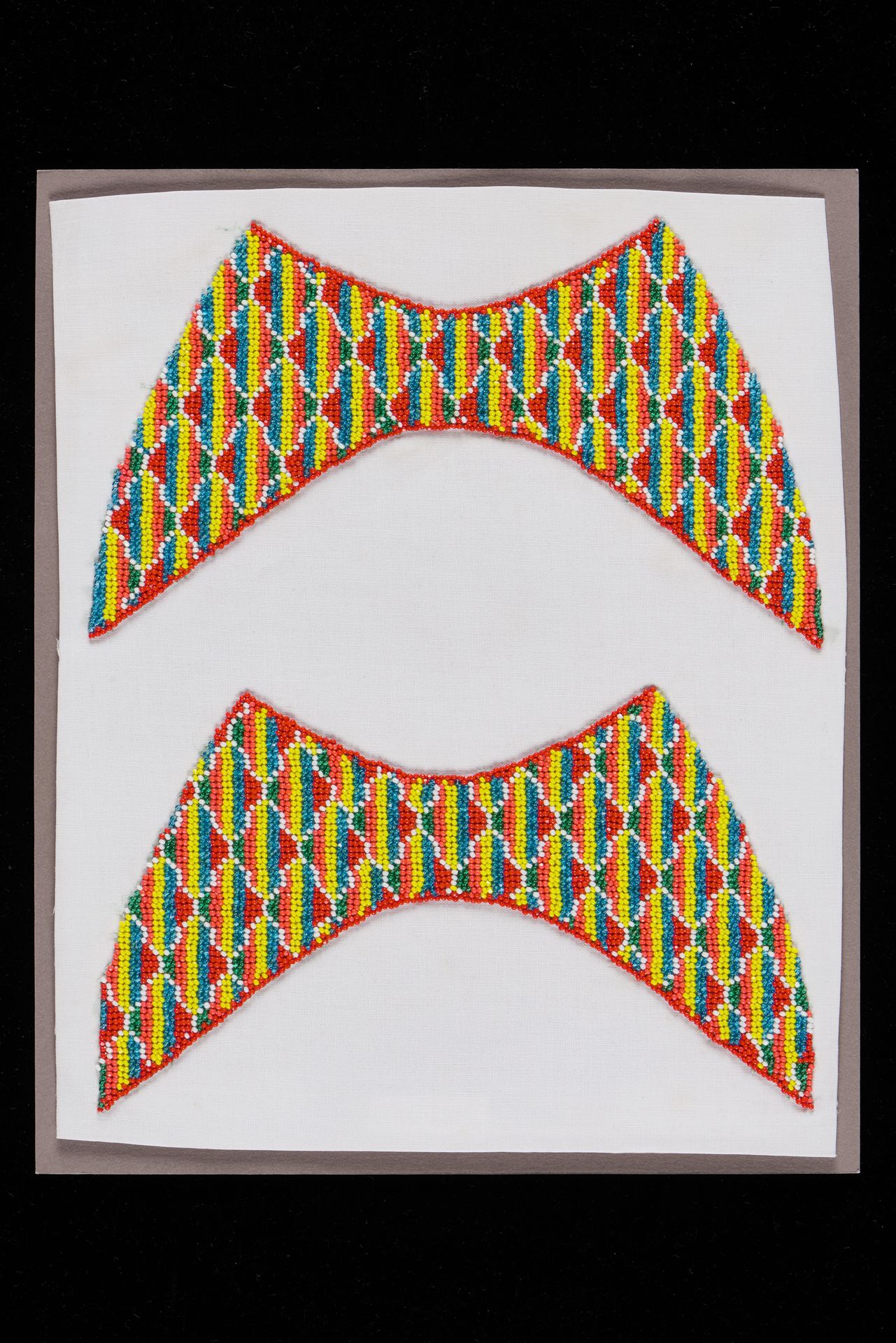 <strong> Pair of slipper faces<br>
</strong><br>
2012-00228<br>
1960s<br>
Singapore<br>
<span style="color: black;">Collection of the Peranakan Museum<br>
</span>Gift of Mr. and Mrs. Lee Kip Lee<br>
<br>
<p style="color: #000000; margin: 0in 0in 8pt;"><span style="background: white; letter-spacing: 0.4pt;">To see other <em>slipper faces </em>in the NC, click </span><span style="background: white; letter-spacing: 0.4pt; color: #0070c0;">here</span><span style="background: white; letter-spacing: 0.4pt;">.</span>